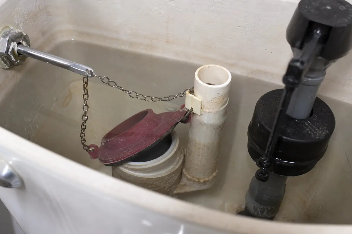 toilet tank chain hanging too loose near the flapper as the failure point to check before adjustment