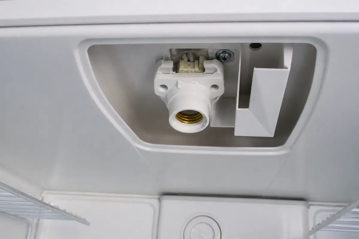 model-matched refrigerator light socket dry-fit in the liner opening before fastening