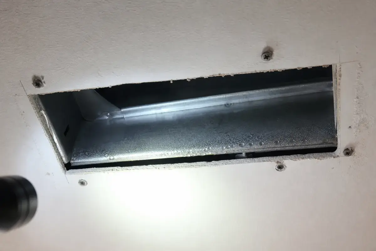 Supply register removed to inspect wet boot gap and water tracks