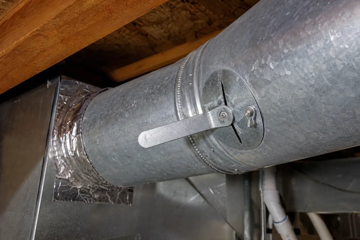 Manual duct balancing damper matched after confirming the upstairs run is restricted