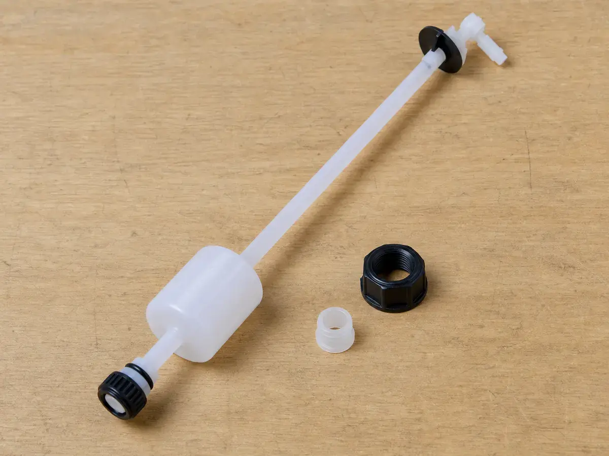 Water softener brine float assembly shown before matching the brine tank style