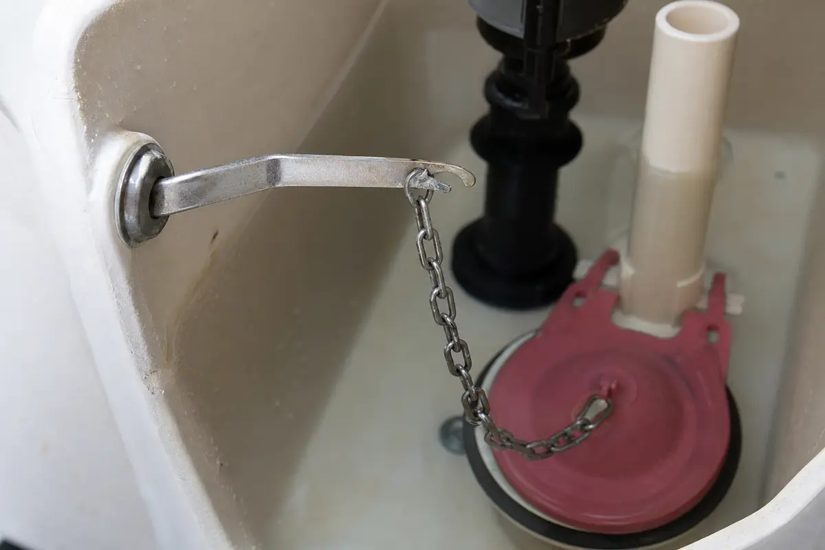 Toilet trip lever for handle and chain lift checks