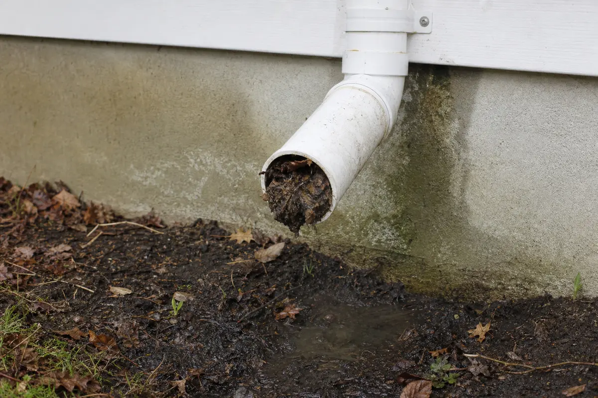 Sump pump discharge outlet blocked enough to make water return toward the pit