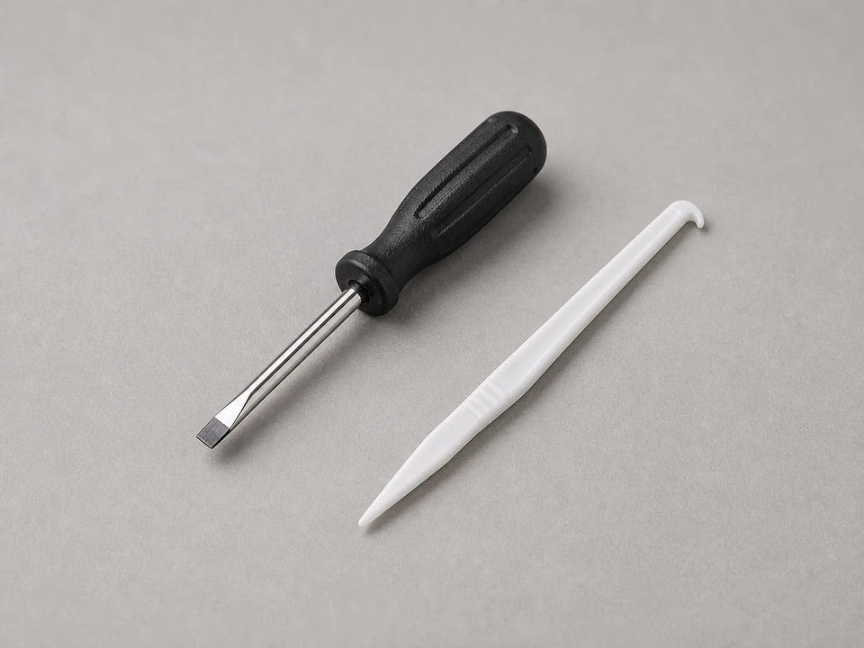 Flat screwdriver or small pick for lifting screen spline near a frame corner