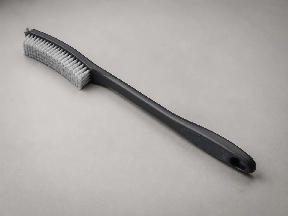 Soft condenser brush for loosening debris from outdoor unit fins