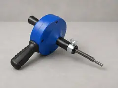 Hand auger or drain snake tool