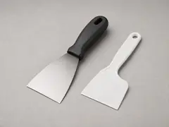 Putty knife or stiff scraper tool