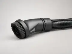 Vacuum with brush attachment tool